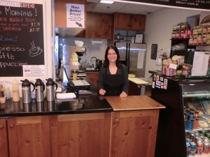 Stela serving smiles and coffee at The Bookmark Cafe.